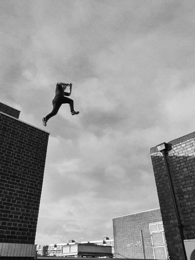 Andy jumps across two buildings